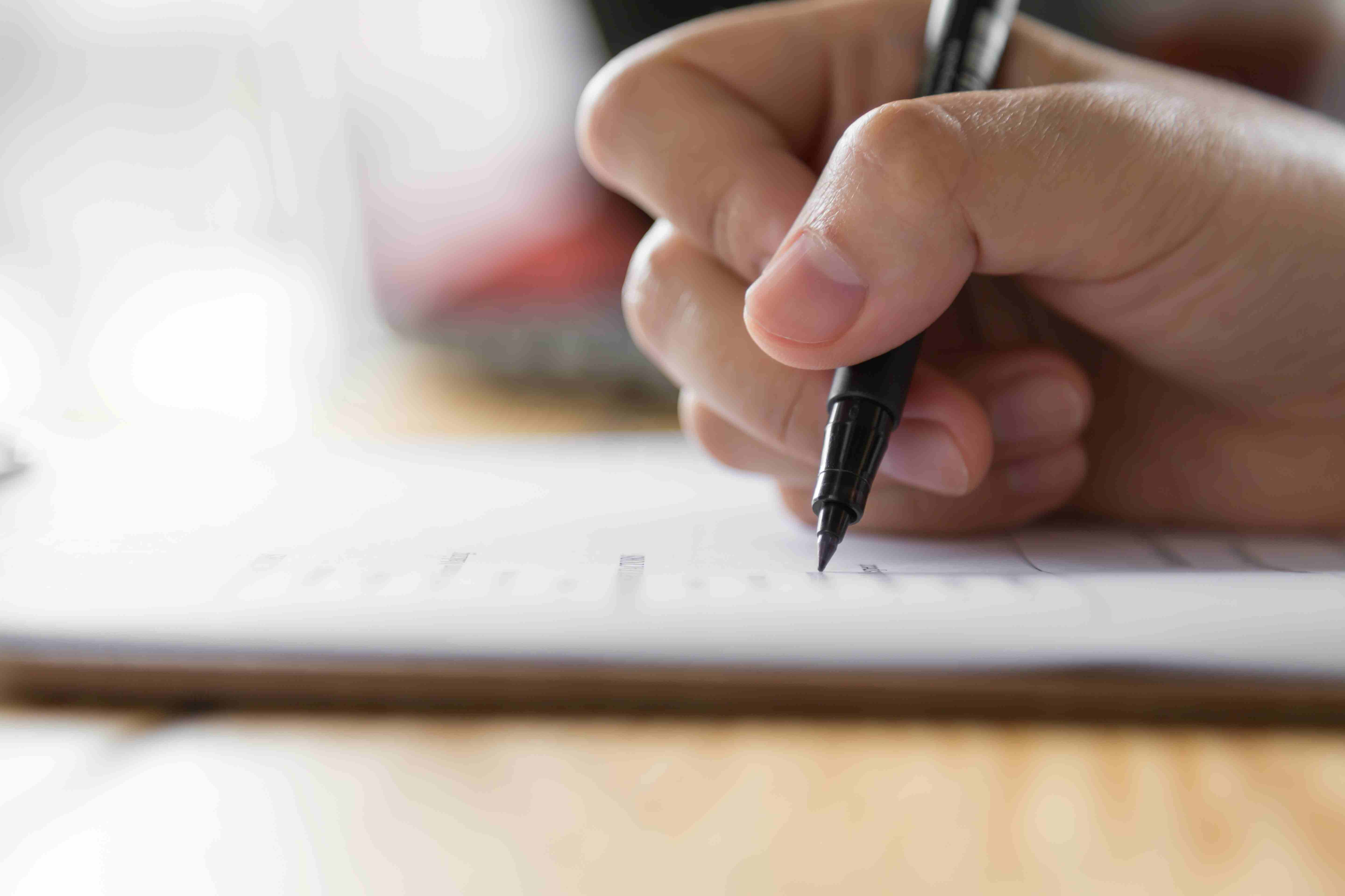 Hand writing on checklist, image by Freepiks.