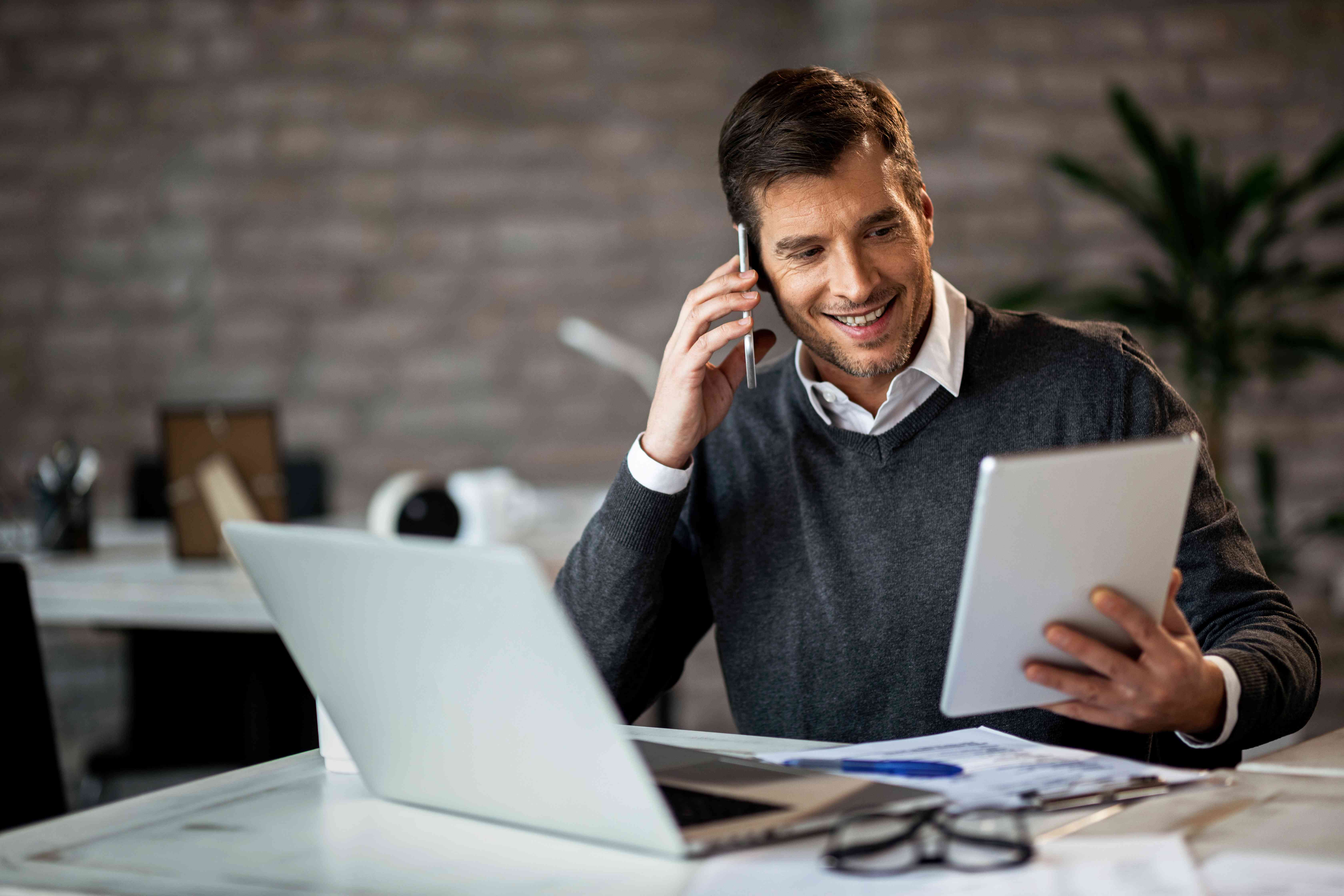 Health insurance broker reviewing documents for open enrollment.