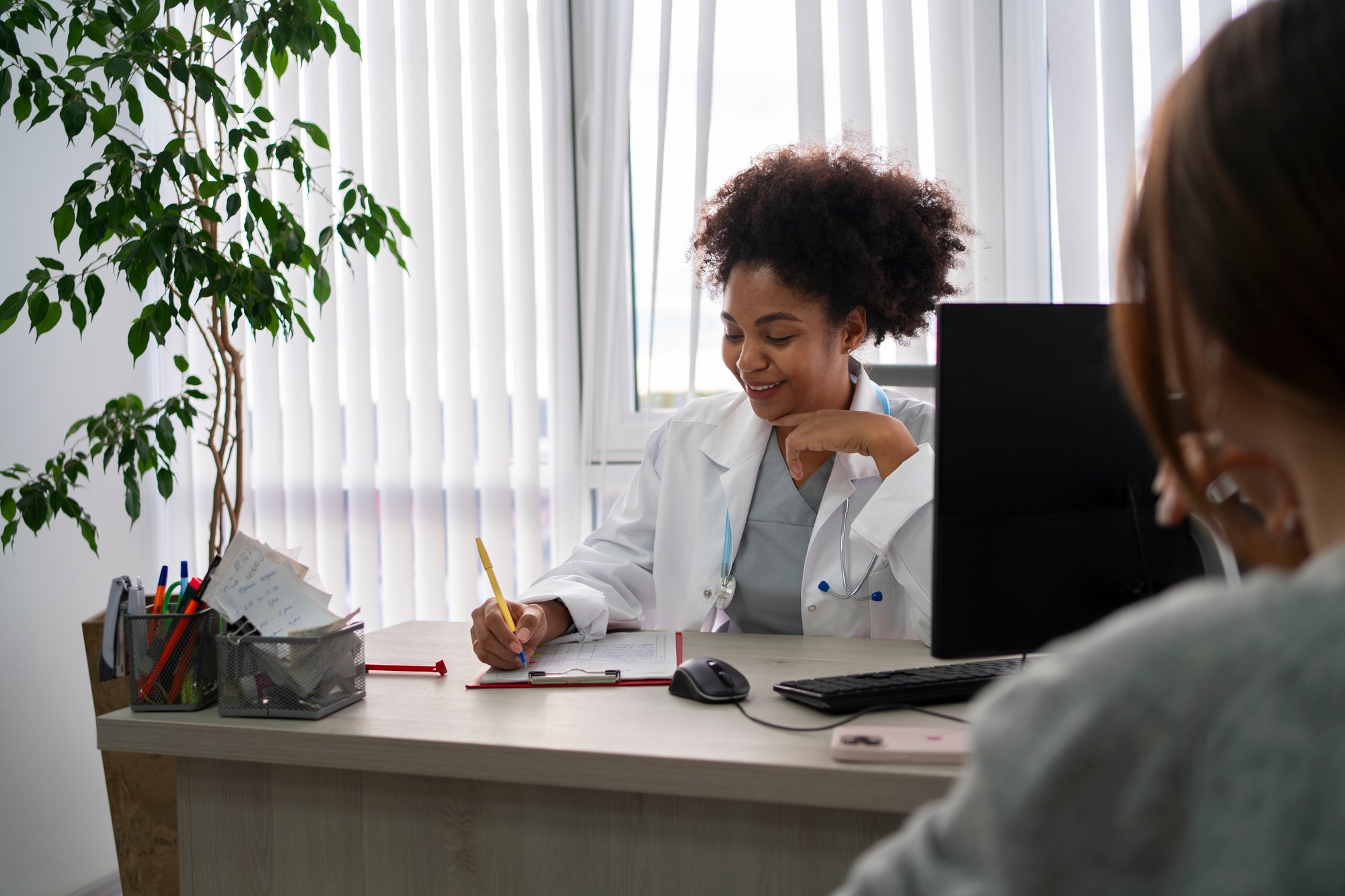 side-view-smiley-doctor-taking-notes