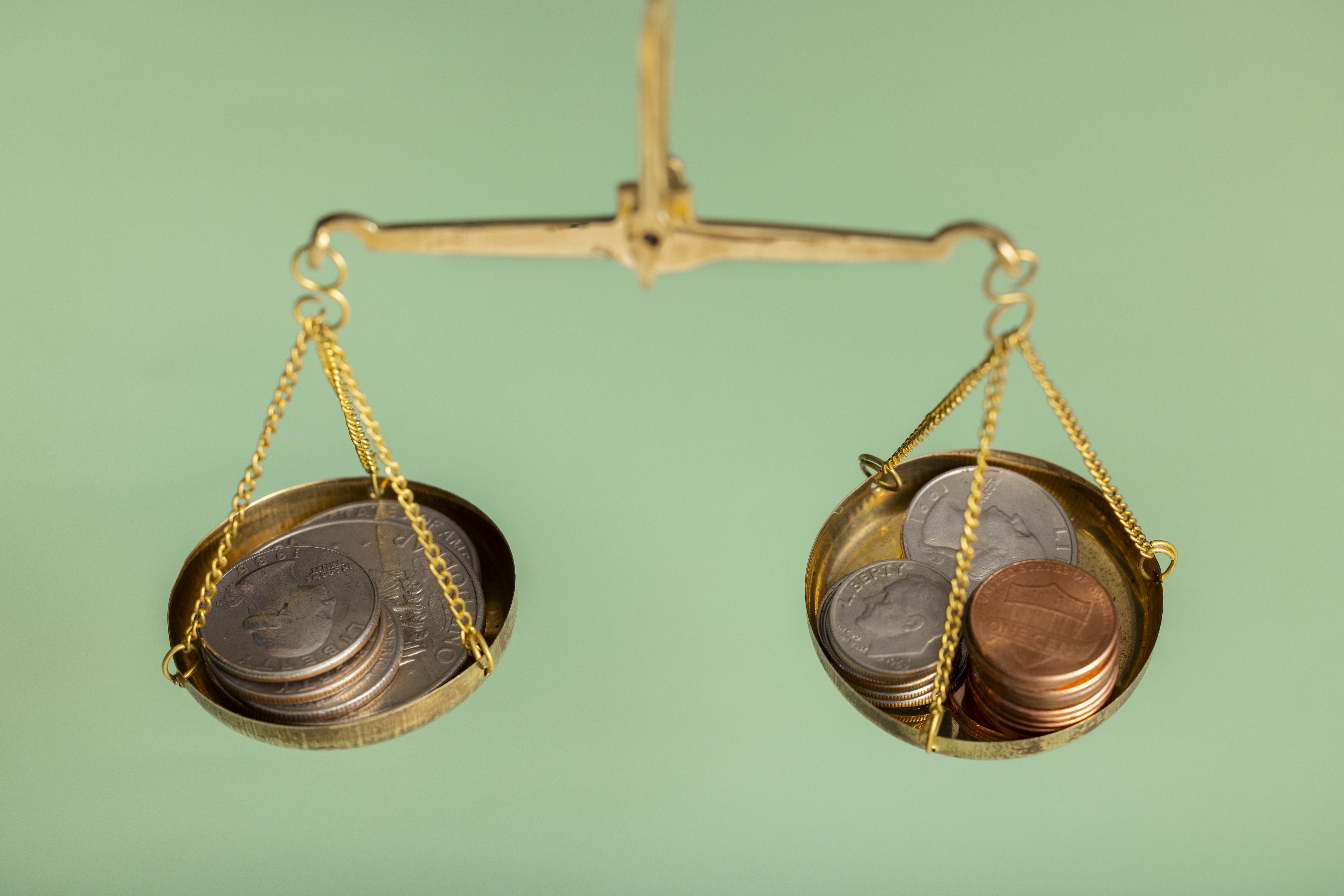 Coins weighed on a traditional scale.